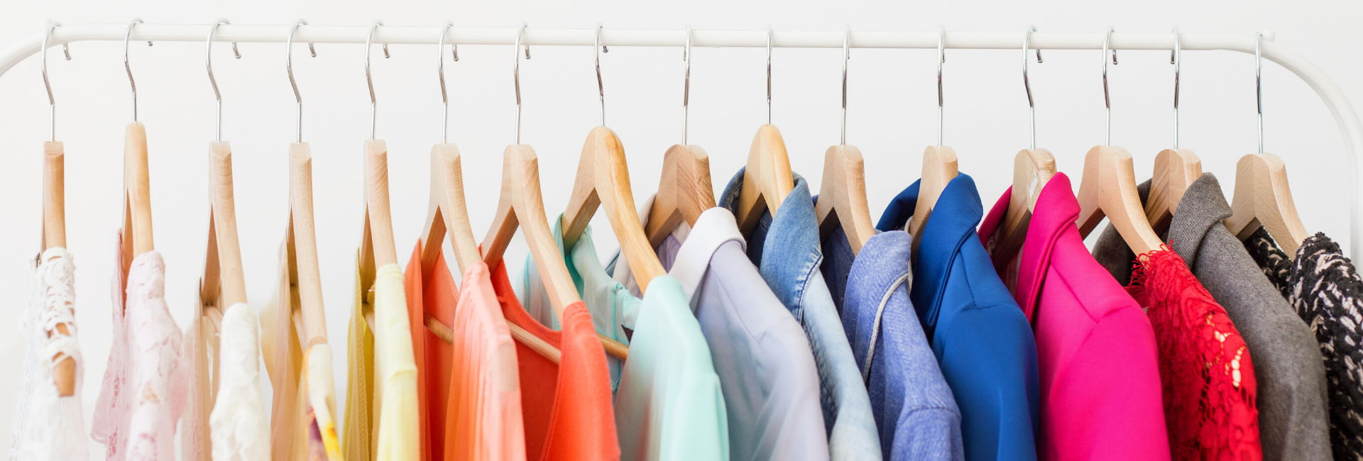 hanging rack of several colorful items of clothing