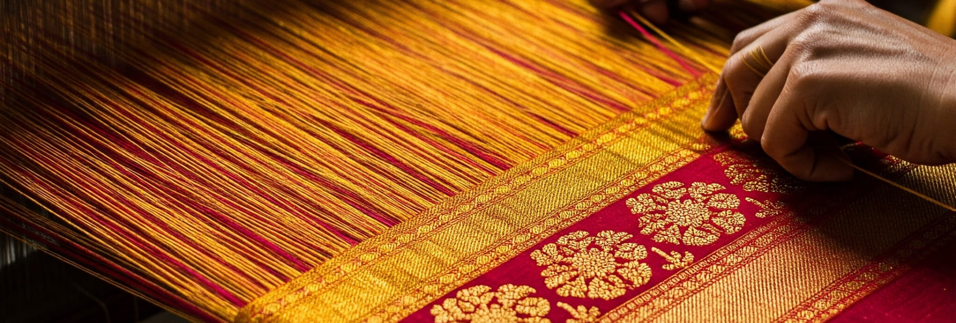 A picture of a person weaving a textile.