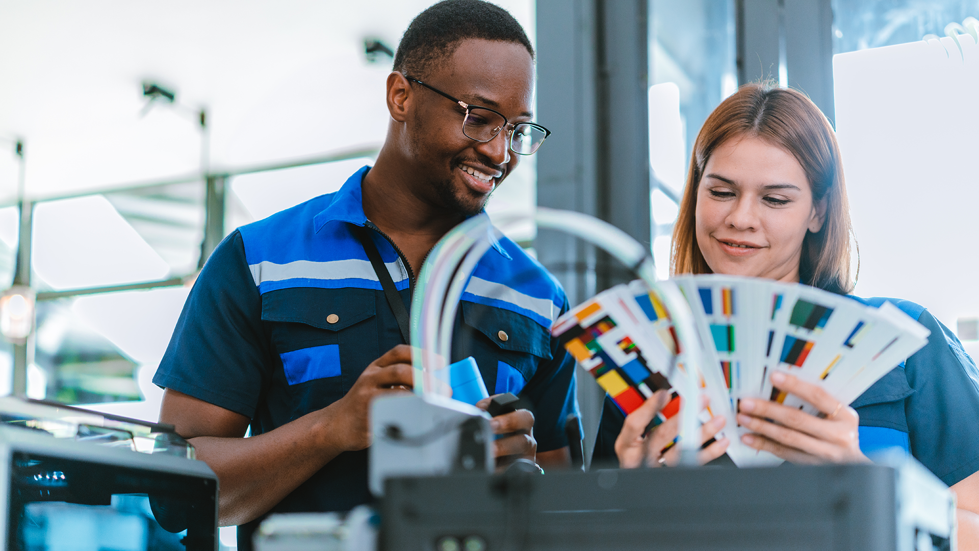 two employees choosing swatches for a print piece