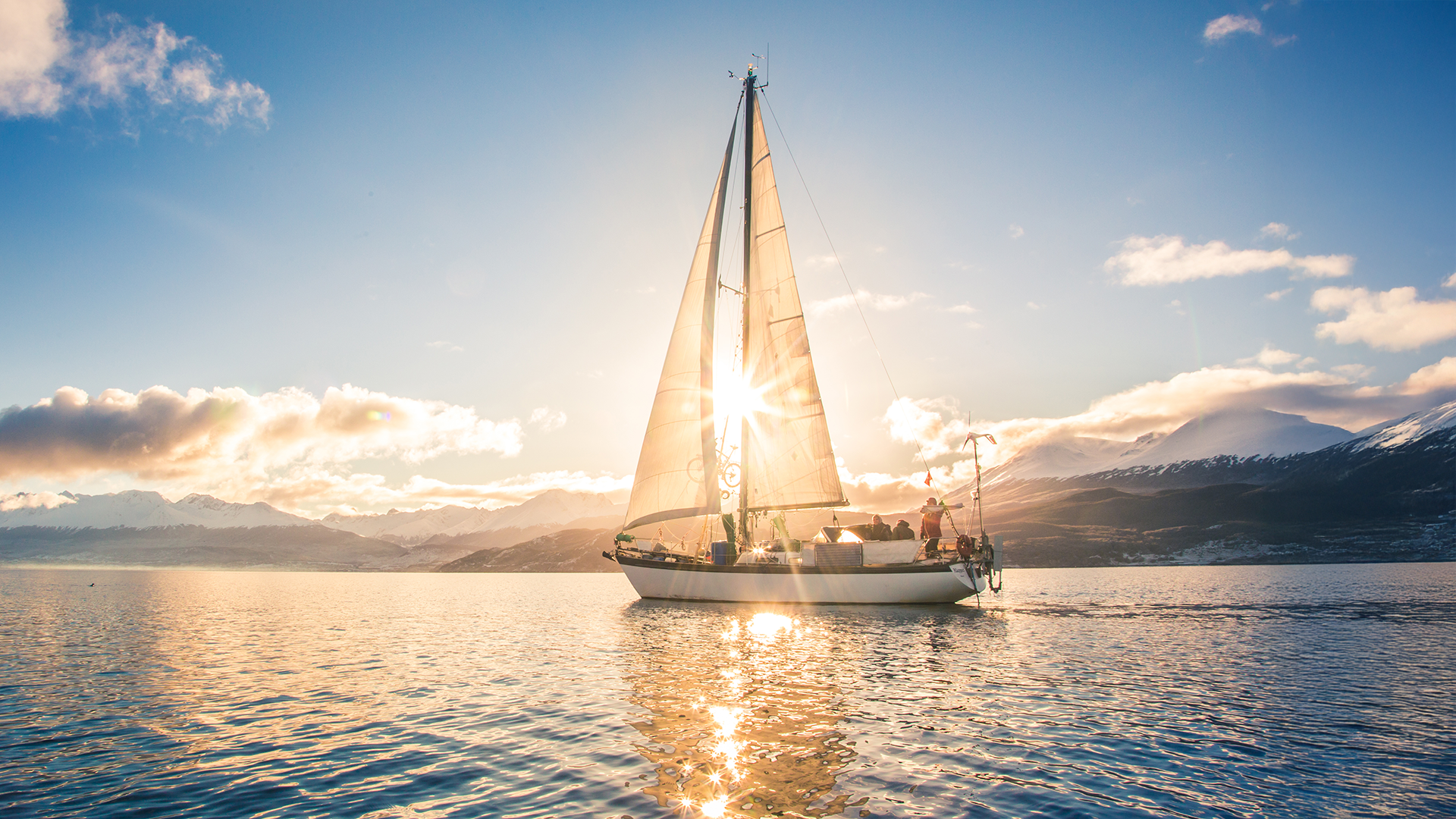 sailing boat on the water at sunrise